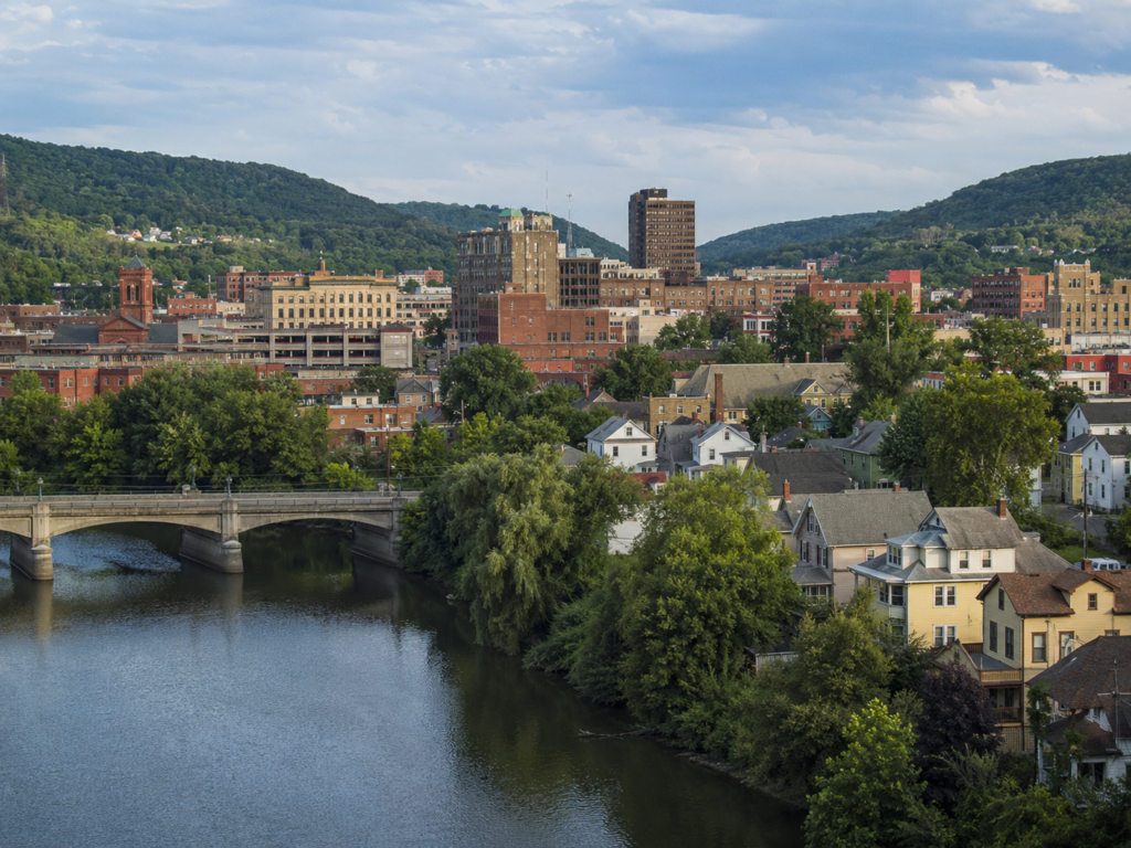River-front view of Binghamton with older single family homes ready to be renovated and flipped