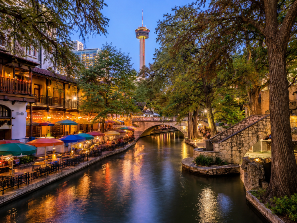 The river walk at dusk in San Antonio with restaurants and hotels.