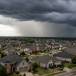 A large suburban housing subdivision with storm clouds overhead.
